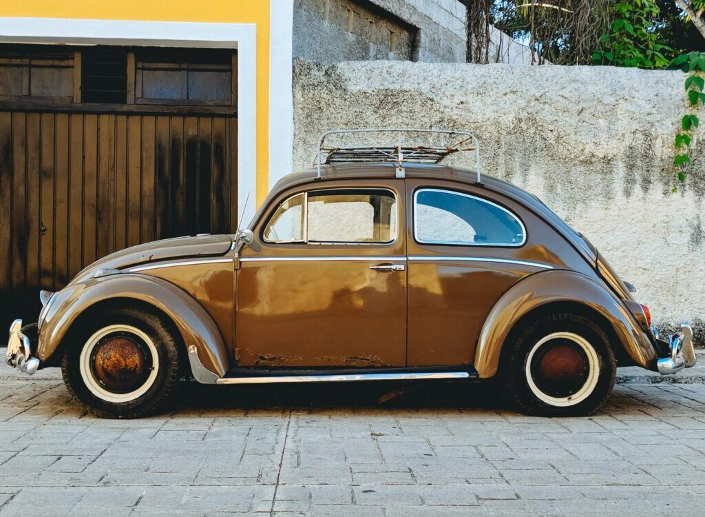 parked brown Volkswagen beetle
