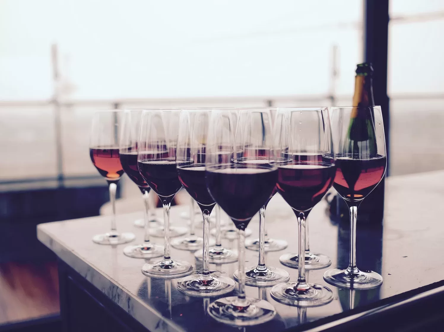Wine Glass With Red Liquid on Black Table